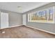 Living room has wood floors and a large window that provides plenty of natural light at 1883 Clarke Ln, Decatur, GA 30035