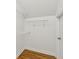 Walk-in closet with wooden floor and white wire shelving for optimal storage at 3923 Ashford Lake Ne Ct, Brookhaven, GA 30319