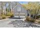 Charming home with two-car garage, mature trees, and well-maintained landscaping at 3923 Ashford Lake Ne Ct, Brookhaven, GA 30319