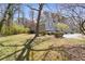 Exterior view of home with a large front yard at 3923 Ashford Lake Ne Ct, Brookhaven, GA 30319