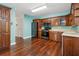 Well-appointed kitchen with wood cabinets, stainless steel appliances, and hardwood flooring at 3923 Ashford Lake Ne Ct, Brookhaven, GA 30319