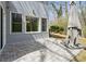 Backyard patio area with tiled floor and view of wooded area at 3923 Ashford Lake Ne Ct, Brookhaven, GA 30319