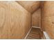 Unfinished storage space with plywood walls and vinyl flooring at 3923 Ashford Lake Ne Ct, Brookhaven, GA 30319