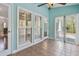 Inviting sunroom offering tile flooring, large windows, and seamless access to the outdoors at 3923 Ashford Lake Ne Ct, Brookhaven, GA 30319