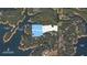 Aerial view showcases a waterfront community with access to a community dock and scenic views at 4595 Ryker Rd, Cumming, GA 30041