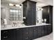 Luxurious bathroom features a double vanity, elegant marble countertop, and modern fixtures at 4595 Ryker Rd, Cumming, GA 30041