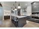 Kitchen with two-tone cabinets, stainless appliances, marble countertops, and pendant lighting at 4595 Ryker Rd, Cumming, GA 30041