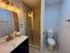 Modern bathroom featuring a walk-in shower with glass door, stylish vanity, and modern fixtures at 877 Verona Dr, Clarkston, GA 30021