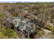 Bird's eye view of a multi-story condo building nestled among mature trees with parking at 102 Barrington Hills Dr, Atlanta, GA 30350