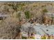 Aerial view of an apartment community shows mature trees and lush surroundings at 102 Barrington Hills Dr, Atlanta, GA 30350