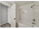 Renovated bathroom with white subway tile surround, updated shower fixtures, and a convenient built-in niche at 102 Barrington Hills Dr, Atlanta, GA 30350