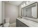 Updated bathroom featuring a vanity with marble countertop and a large mirror, plus a subway tile shower at 102 Barrington Hills Dr, Atlanta, GA 30350
