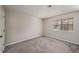 Comfortable bedroom with neutral carpet and a bright window at 102 Barrington Hills Dr, Atlanta, GA 30350