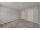 Spacious bedroom with soft carpet and multiple closets for ample storage at 102 Barrington Hills Dr, Atlanta, GA 30350