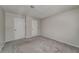 Large bedroom featuring neutral carpeting and multiple closet doors at 102 Barrington Hills Dr, Atlanta, GA 30350