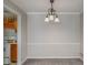 Bright dining room featuring a decorative chandelier and neutral paint at 102 Barrington Hills Dr, Atlanta, GA 30350