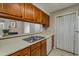 Kitchen view with a functional sink and cabinet storage above countertop at 102 Barrington Hills Dr, Atlanta, GA 30350