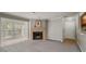 Living room featuring a fireplace and entryway and bar into the kitchen at 102 Barrington Hills Dr, Atlanta, GA 30350