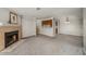 Spacious condo interior showcasing a cozy fireplace, gray carpet, and white molding at 102 Barrington Hills Dr, Atlanta, GA 30350