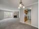 Spacious living area with a fireplace and a view into the kitchen at 102 Barrington Hills Dr, Atlanta, GA 30350