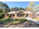 Charming home with a beautiful backyard, patio, and well-manicured lawn at 2272 Kimberley Way, Snellville, GA 30078
