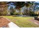 Expansive backyard featuring an in-ground pool and lush lawn, ideal for outdoor activities and gatherings at 2272 Kimberley Way, Snellville, GA 30078
