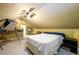 Cozy bedroom with a unique slanted ceiling and a modern ceiling fan at 2272 Kimberley Way, Snellville, GA 30078