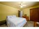 A cozy bedroom showcasing a ceiling fan, a closet, and ample natural light at 2272 Kimberley Way, Snellville, GA 30078