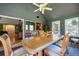 Dining room showcases an open floor plan, hardwood floors, and backyard views at 2272 Kimberley Way, Snellville, GA 30078