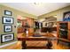 Inviting home office area flows into the living room, offering a spacious work environment with beautiful hardwood floors at 2272 Kimberley Way, Snellville, GA 30078