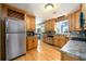 Bright kitchen with stainless steel appliances, ample counter space, and hardwood floors at 2272 Kimberley Way, Snellville, GA 30078
