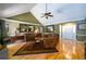Bright living room with hardwood floors, fireplace, and access to other rooms in the home at 2272 Kimberley Way, Snellville, GA 30078