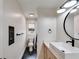 Contemporary bathroom featuring sleek fixtures, vanity with a vessel sink, and a stylish mirror at 118 Raven Rd, Villa Rica, GA 30180
