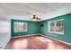 Spacious bedroom featuring hardwood flooring and plenty of natural light at 118 Raven Rd, Villa Rica, GA 30180