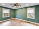 Bright bedroom with hardwood floors, offering natural light and a spacious feel at 118 Raven Rd, Villa Rica, GA 30180