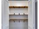 Bright closet featuring wooden shelves and storage space at 118 Raven Rd, Villa Rica, GA 30180