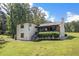 A charming two-story home with a stone-accented porch and well-maintained lawn, blending character and curb appeal at 118 Raven Rd, Villa Rica, GA 30180