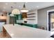 Bright kitchen boasts an island, quartz countertops, and stainless steel appliances at 118 Raven Rd, Villa Rica, GA 30180
