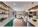Open concept kitchen leading to dining area and built in shelving at 118 Raven Rd, Villa Rica, GA 30180