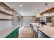 Bright kitchen features an island, quartz countertops, and stainless steel appliances at 118 Raven Rd, Villa Rica, GA 30180