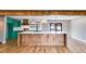 Modern kitchen with custom island, stylish light fixtures and colorful cabinets at 118 Raven Rd, Villa Rica, GA 30180