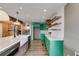 Kitchen with wooden island, stainless steel appliances, quartz countertops, and teal cabinets at 118 Raven Rd, Villa Rica, GA 30180
