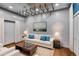 Charming living room featuring a comfortable sofa and decorative lighting at 118 Raven Rd, Villa Rica, GA 30180
