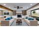 Cozy living room with a fireplace, built-in shelves, and comfortable seating arrangement at 118 Raven Rd, Villa Rica, GA 30180