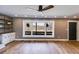 Bright, open living room with hardwood floors, large windows, and comfortable lighting at 118 Raven Rd, Villa Rica, GA 30180