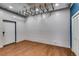 Bright living room featuring hardwood floors, metal ceiling and white shiplap walls at 118 Raven Rd, Villa Rica, GA 30180