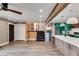 Open living space leading to the eat-in kitchen, and a stairwell at 118 Raven Rd, Villa Rica, GA 30180