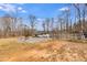 Open yard with a swing set and fenced perimeter at 118 Raven Rd, Villa Rica, GA 30180
