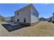 An exterior of a house with a concrete patio in the backyard and vinyl siding at 1659 Hay Patch Ln, Loganville, GA 30052