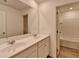 Bathroom featuring a double vanity with a large mirror and a doorway to the tub and toilet at 1659 Hay Patch Ln, Loganville, GA 30052